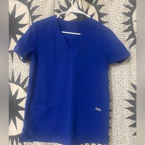 Figs casma winning blue scrub top.